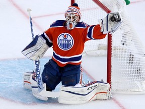 Edmonton Oilers' goaltender Cam Talbot (33) makes a glove save during first period play against the Winnipeg Jets' at the NHL Heritage Classic at Investors Group Field in Winnipeg, Sunday, October 23, 2016.
