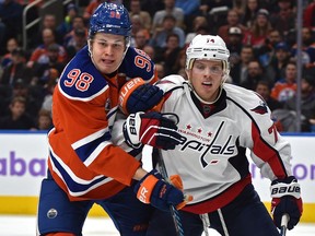Edmonton Oilers Jesse Puljujarvi (98) and Washington Capitals John Carlson (74) battle in front of the net during NHL action at Roger's Place in Edmonton, Wednesday, October 26, 2016. Ed Kaiser/Postmedia (Edmonton Journal story Jim Matheson) Photos off Oilers game for multiple writers copy in Oct. 27 editions.