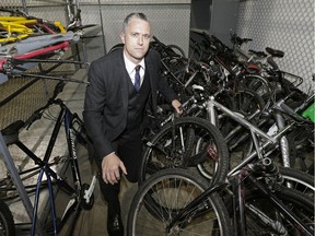 Edmonton Police Service Staff Sgt. Jonathan Coughlan of the northwest division criminal investigation section with some recovered stolen bicycles at a police storage facility on Oct. 5, 2016. Six adults have been charged after police discovered a bicycle chop shop in the city.