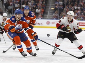 Edmonton Oilers defenceman Adam Larsson (6) chases Ottawa Senators forward Ryan Dzingel (18) during NHL action in Edmonton on Oct. 30, 2016.