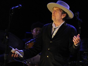 This file photo taken on July 22, 2012 shows U.S. poet and folk singer Bob Dylan performing during the 21st edition of the Vieilles Charrues music festival in Carhaix-Plouguer, western France. Dylan won the Nobel Literature Prize on Oct. 13, 2016, the first songwriter to win the prestigious award.