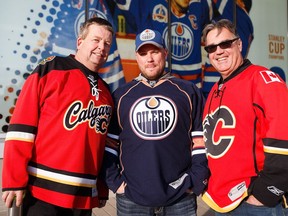 Gord Orr, left, Blair Coughlin and Ken Rozniak stop for a picture before the Edmonton Oilers home opener against the Calgary Flames at Rogers Place in Edmonton on Wednesday, Oct. 12, 2016.