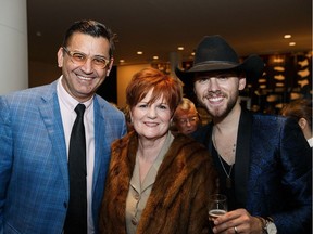 Edmonton public school trustee Orville Chubb, left, with Trudy Callaghan and Brett Kissel during the Fashion With Compassion gala at the Shaw Conference Centre, favours continued partial funding for private schools.