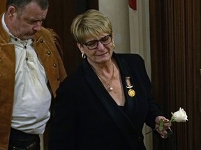 Lesley Miller, right, grieves at the funeral service for her husband, Dougald Miller, at Park Memorial in Edmonton on Tuesday Oct. 4, 2016. On Nov. 21, 2000, Dougald Miller, a rental apartment landlord, encountered Leo Teskey sleeping in the hallway of his rental property. When Miller tried to make him leave, Teskey beat him into a coma. After 16 years Miller died at the age of 77 on Sept. 24, 2016. Teskey is one of 50 criminals in Alberta who have been sentenced as dangerous offenders and remains in custody at a federal institution.