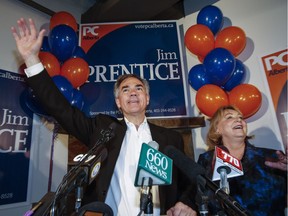 Alberta Premier Jim Prentice, left, celebrates with his wife Karen after winning a seat in the provincial legislature following a byelection in Calgary on Oct. 27, 2014.