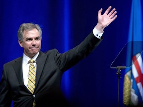 Jim Prentice waves after his speech at the Alberta PC Dinner in Calgary, Alberta on Thurs. May 14, 2015.