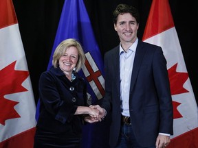 Prime Minister Justin Trudeau, right, meets with Alberta Premier Rachel Notley following meetings at a Liberal Party cabinet retreat in Kananaskis, on April 24, 2016.