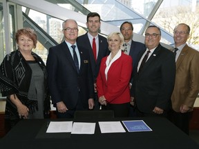 From left: Roxanne Carr (mayor, Strathcona County), Stuart Houston (mayor, City of Spruce Grove), Don Iveson (mayor, City of Edmonton), Gale Katchur (mayor, City of Fort Saskatchewan), Rodney Shaigec (mayor, Parkland County), Greg Krischke (mayor, City of Leduc) and John Whaley (mayor, Leduc County) at the Art Gallery of Alberta on Monday, Oct. 3, 2016 where the Metro Mayors Alliance signed a memorandum of understanding outlining a commitment to plan, decide and act as one Edmonton Metro Region. St. Albert Mayor Nolan Crouse and Sturgeon County Mayor Tom Flynn signed the document ahead of time.
