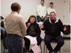 Brenda and Chris Christianson (seated) express concerns to Atco's Darlene Cox to discuss gas line relocation concerns on Saturday, October 29, 2016.