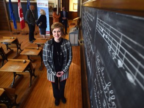 A happy Cindy Davis, Archives and Museum manager at the school, after Randy Boissonnault, MP for Edmonton Centre announced complete $2.4 million roof structural repair and restoration funding for McKay Avenue School in Edmonton Thursday, October 13, 2016.