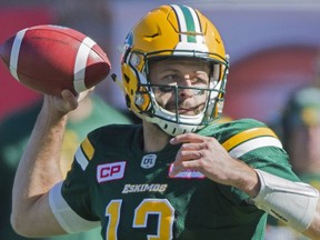 Edmonton Eskimos' quarterback Mike Reilly throws a pass during first half CFL football action against the Montreal Alouettes in Montreal, Monday, October 10, 2016.