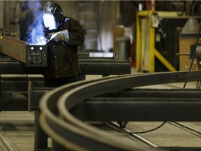 A welder is shown at Collins Steel, an Edmonton company that helped finance the creation of a steel structures education and research centre at the University of Alberta.