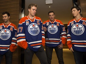 From left to right, Jordan Eberle, Connor McDavid, Milan Lucic, and Ryan Nugent-Hopkins walk out of the Oilers' dressing room wearing 'A's as alternate captains and, in McDavid's case, a 'C'as team captain following an Edmonton Oilers' practice at Rogers Place on Oct. 5, 2016.