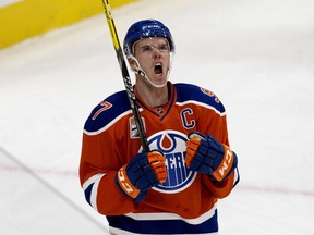The Edmonton Oilers' Connor McDavid (97) celebrates his first goal against the Calgary Flames during second period NHL action at Rogers Place, in Edmonton on Wednesday Oct. 12, 2016.
