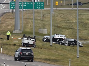 Police investigate a fatal collision between two pickup trucks, one of which crossed the centre median and struck the other on Anthony Henday Drive on Oct. 7, 2016.