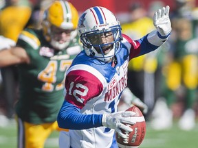 Montreal Alouettes quarterback Rakeem Cato breaks away from a tackle during first half CFL football action against the Edmonton Eskimos in Montreal, Monday, October 10, 2016.