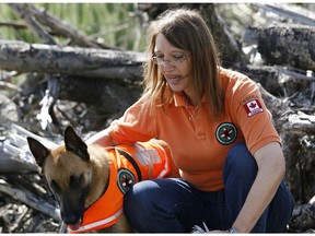 Silvie Montier with her search dog "Dante" after returning from a search and rescue mission in Peru in 2007.