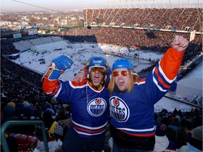 Eric Chaungeu, left and Ryan Steinke, right show how crazy fan are at the Commonwealth Stadium at the start of the Heritage Classic hockey game on Nov. 22, 2003.