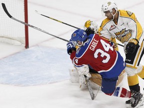 Edmonton's Kole Gable is knocked down by Brandon's Jordan Wharrie during the second period of a WHL game between the Edmonton Oil Kings and the Brandon Wheat Kings at Rogers Place in Edmonton, Alberta on Tuesday, October 25, 2016. Ian Kucerak / Postmedia Photos off Oil Kings game for Oct. 26 editions.