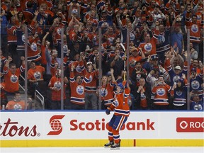 Connor McDavid (97) celebrates after scoring on a penalty shot during the second period of an NHL game between the Edmonton Oilers and the Calgary Flames at Rogers Place in Edmonton on Oct. 12, 2016.