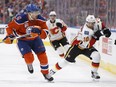 Edmonton's Adam Larsson (6) chases Calgary's Kris Versteeg (10) during the first period of a NHL game between the Edmonton Oilers and the Calgary Flames at Rogers Place in Edmonton, Alberta on Wednesday, October 12, 2016. Ian Kucerak / Postmedia Photos off Oilers game for multiple writers copy in Oct. 13 editions.
