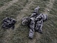 The frost-covered clothing of Edmonton's 36th homicide victim lays in a field on Sunday October 23, 2016. A blood-stained hooded parka, a mobile telephone and two other items of clothing were found in a recreation area field just south of Fox Drive in southwest Edmonton. The body of Christopher Fawcett, 19-years-old, was discovered in the area by police late Saturday evening (October 22, 2016). Connor James Miller, 21, was charged with second degree murder, possession of a weapon for a dangerous purpose, assault of a peace officer and resisting arrest. Police believe Miller and Fawcett knew each other and that an altercation occurred between the two men. An autopsy by the medical examiner confirmed Fawcett died of stab wounds.