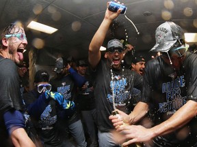 BOSTON, MA - OCTOBER 02:  Members of the Toronto Blue Jays celebrate their 2-1 win over the Boston Red Sox, clinching a Wildcard spot at Fenway Park on October 2, 2016 in Boston, Massachusetts.