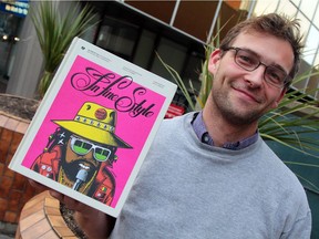 Local author/musician Christopher Bateman with his book In Fine Style: The Dancehall Art of Wilfred Limonious.
