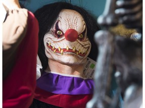 Halloween costumes and props, including a "scary" clown mask, are seen for sale at Total Party, a party store, in Arlington, Virginia, October 7, 2016.