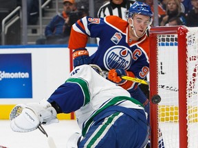 Edmonton Oilers star Connor McDavid scores on Vancouver canucks goalie Jakob Markstrom on Oct. 8, 2016.