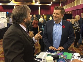 Wildrose Leader Brian Jean speaks with a supporter at the party's annual general meeting in Red Deer Saturday, Oct. 29, 2016.