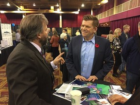 Wildrose Leader Brian Jean speaks with a supporter at the party's AGM in Red Deer on Oct. 29, 2016.