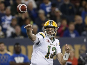 Edmonton Eskimos quarterback Mike Reilly (13) throws against the \Winnipeg Blue Bombers during the first half of CFL action in Winnipeg Friday, September 30, 2016.