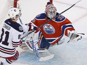 Edmonton Oilers goaltender Cam Talbot (33) saves the shot from Winnipeg Jets' Kyle Connor (81) during second period NHL Heritage Classic action in Winnipeg on Sunday, October 23, 2016. Talbot was named National Hockey League first star of the week Monday after leading the Oilers to three victories last week.