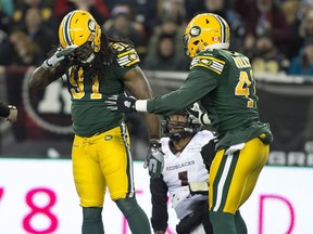 WINNIPEG, MB.-- Edmonton Eskimos Marcus Howard (91) celebrates a sack against the Ottawa Redblacks quarterback Henry Burris during the 103rd Grey Cup on November 29, 2015 in Winnipeg.    (Greg Southam-Edmonton Journal)