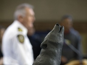 The Wolf Award is visible as Edmonton police Chief Rod Knecht takes part in a ceremony where the Edmonton Police Service received an award Wednesday for its commitment to cultural unity, at EPS headquarters in Edmonton on Wednesday Oct. 26, 2016. The EPS was selected for this award because of the work of its indigenous relations unit and the Oskayak Police Academy.