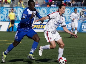 FC Edmonton's Pape Diakite, left, battles the Indy Eleven's Justin Braun during NASL action at Clarke Stadium, in Edmonton on Sunday Oct. 2, 2016. FC Edmonton travel to play the Indy Eleven in an NASL semifinal on Saturday, Nov. 5.