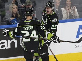 Edmonton's Lane Bauer, right, celebrates a goal with Aaron Irving during the first period of a WHL game between the Edmonton Oil Kings and the Medicine Hat Tigers at Rogers Place  in Edmonton, Alberta on Saturday, October 29, 2016.