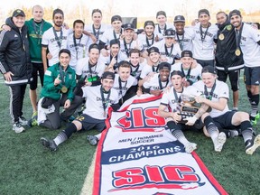 The University of Alberta Golden Bears soccer team celebrate their CIS national championship in Guelph, Ont., on Nov. 12, 2016.