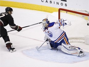 Arizona Coyotes right wing Radim Vrbata, left, scores against Edmonton Oilers goalie Cam Talbot during the shootout of an NHL hockey game Friday, Nov. 25, 2016, in Glendale, Ariz. The Coyotes won 3-2.