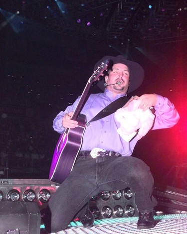 Edmonton-08/10/96-GARTH BROOKS 3-Garth Brooks performs to a sold out audience in Edmonton tonight. Photo by Larry Wong/Edmonton Journal.