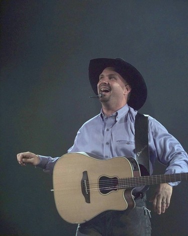 Edmonton-08/10/96-BROOKS CONCERT 2-Garth Brooks performs to a sold out concert in Edmonton today. Photo by Larry Wong/Edmonton Journal. 

LOCAL CAPTION: Garth Brooks belongs in the category of the Beatles and Rolling Stones