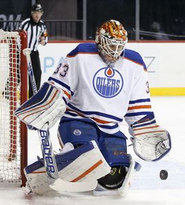 Edmonton Oilers goalie Cam Talbot (33) makes a save in the second period of an NHL hockey game against the New York Islanders in New York, Sunday, Feb. 7, 2016.