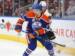 Kris Russell of the Edmonton Oilers defends against Patrick Kane of the Chicago Blackhawks on Nov. 21, 2016 at Rogers Place in Edmonton.