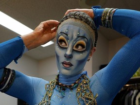 Cirque du Soleil performer Jessica Ward puts on her Toruk makeup and costume in Edmonton on Tuesday Nov. 29, 2016.