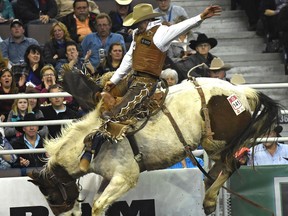 Clay Elliott from Nanton, AB, scores 85 to win the saddle bronc riding champion during the Canadian Finals Rodeo at Northlands Coliseum in Edmonton, Sunday, November 13, 2016. Ed Kaiser/Postmedia (Edmonton Journal story by Jason) Photos off CFR for Jason Hills story in Monday, Nov. 14 publications.