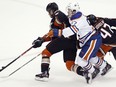 Edmonton Oilers captain Connor McDavid, centre, gets stopped by Anaheim Ducks defenseman Kevin Bieksa, left, and defenseman Hampus Lindholm, of Sweden, during the third period of an NHL hockey game in Anaheim, Calif., Tuesday, Nov. 15, 2016. The Ducks won 4-1.