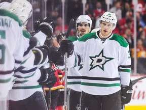 CALGARY, AB - NOVEMBER 10: Lauri Korpikoski #38 (C) of the Dallas Stars celebrates with his teammates after scoring against the Calgary Flames during an NHL game at Scotiabank Saddledome on November 10, 2016 in Calgary, Alberta, Canada.