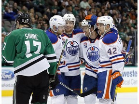 Dallas Stars' Devin Shore (17) skates away as Edmonton Oilers' Leon Draisaitl of Germany, from left, Adam Larsson (6), Oscar Klefbom and Anton Slepyshev (42) of Russia, celebrate a goal by Klefbom in the second period of an NHL hockey game, Saturday, Nov. 19, 2016, in Dallas.