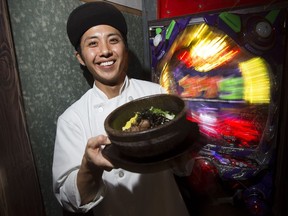 Dorinku's  Takeshi Kawabe poses for a photo with Ishiyaki Beef Bibimbap.